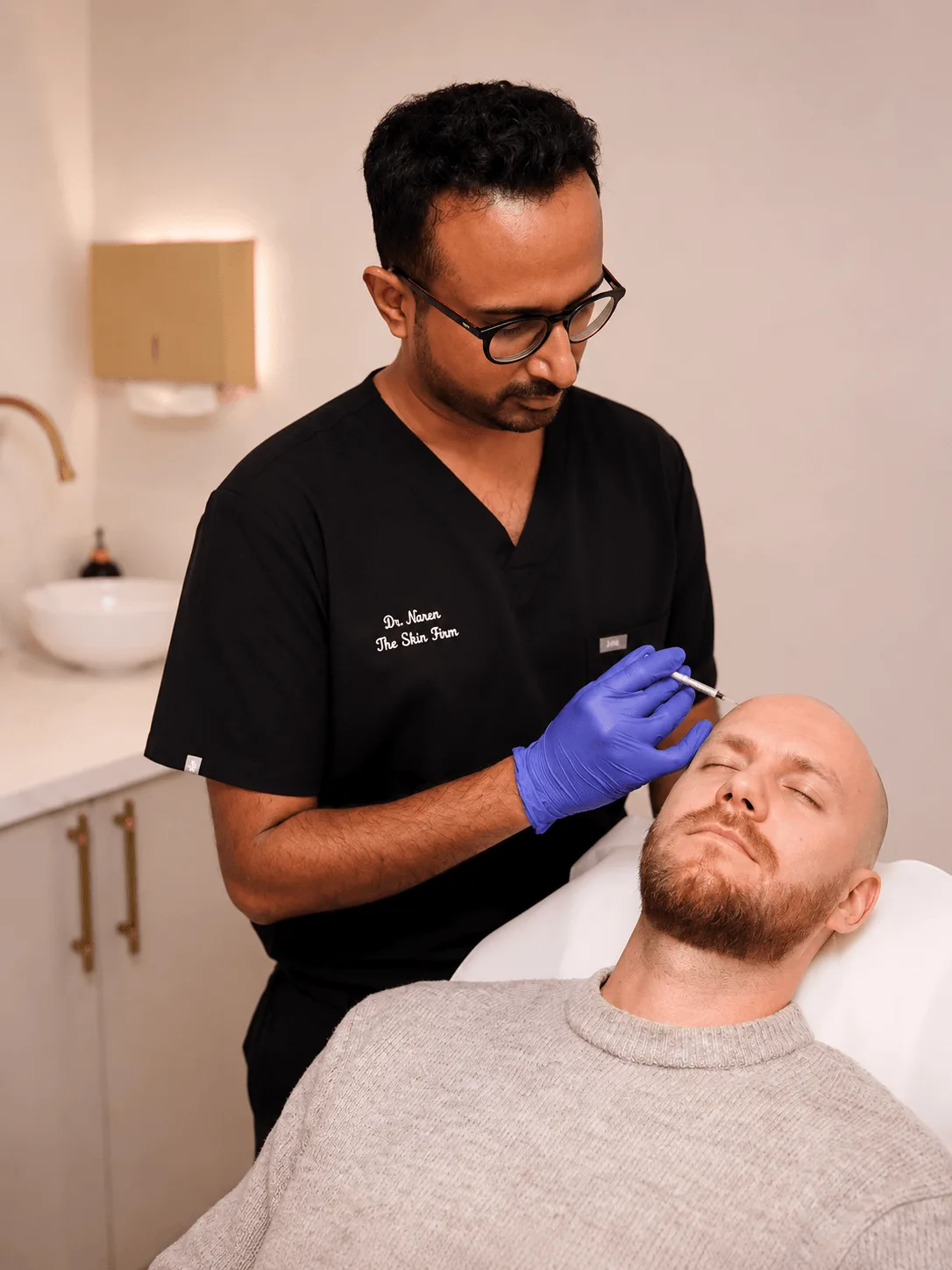 Dr Naren administering an injection at The Skin Firm Sheffield